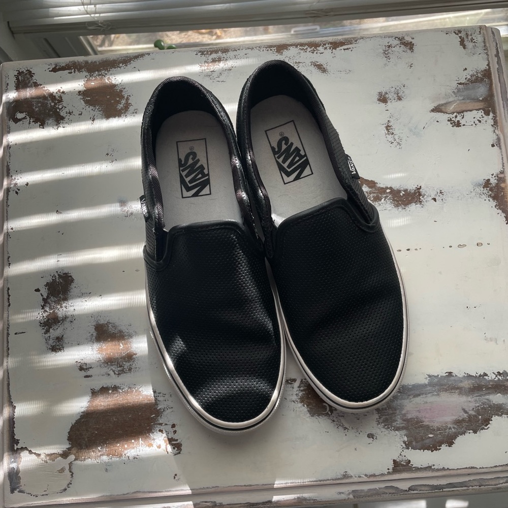 Size 8 Black leather Vans slip ons no signs of wear, worn a couple times